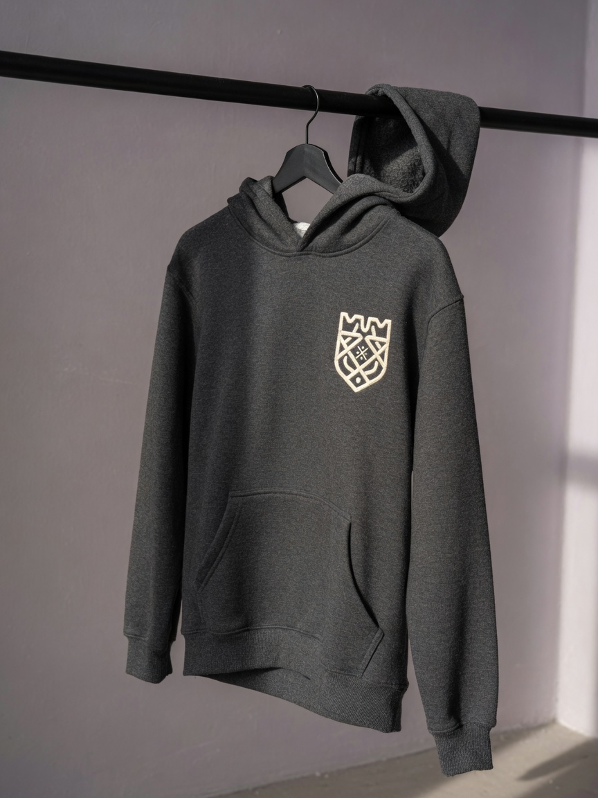 Charcoal hoodie on a rail